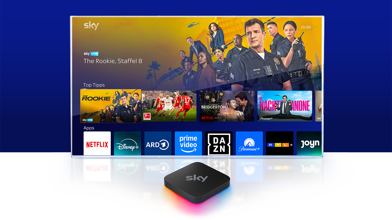 Sky Stream Box vor einem Fernseher, auf dem das Sky Stream UI zu sehen ist.